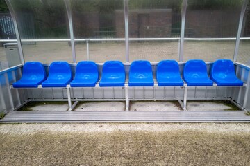 empty seats for coach and team in a stadium