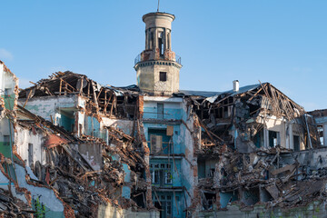 Old collapsed Stalinist residential building on a sunny day, Saint Petersburg