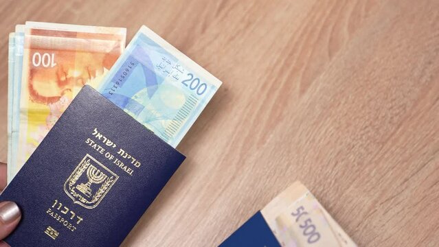 Passport of a citizen of Israel and passport of a citizen of Ukraine, repatriation, aliyah. Paper bills, new Israeli shekel and hryvnia. Absorption basket. Assistance under the Law of Return.