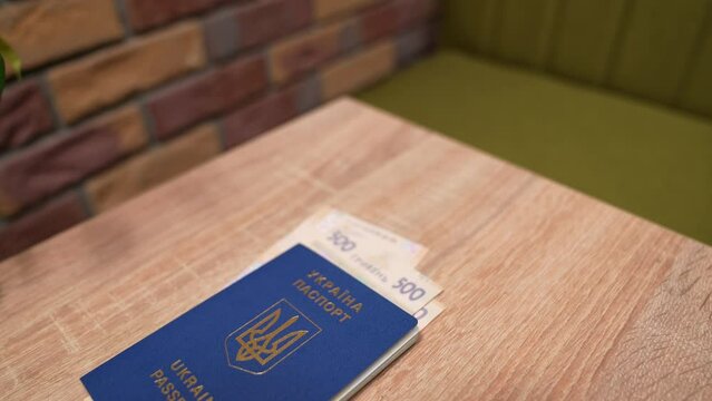 Passport of a citizen of Israel and passport of a citizen of Ukraine, repatriation, aliyah. Paper bills, new Israeli shekel and hryvnia. Absorption basket. Assistance under the Law of Return.