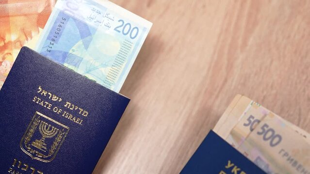 Passport of a citizen of Israel and passport of a citizen of Ukraine, repatriation, aliyah. Paper bills, new Israeli shekel and hryvnia. Absorption basket. Assistance under the Law of Return.