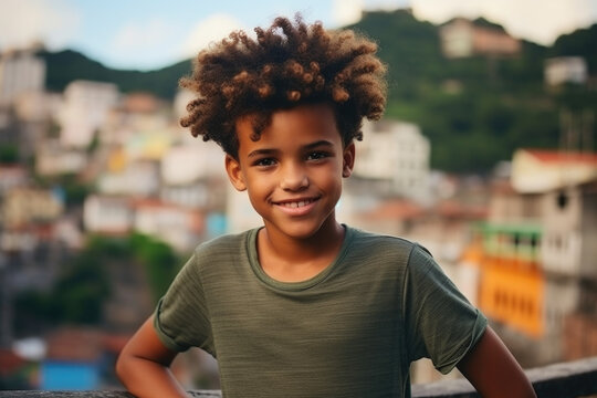 Smiling boy against the backdrop of favelas with colorful houses.