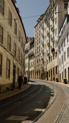 Lisbon, Portugal - May 25, 2023: Narrow street of Lisbon historical center