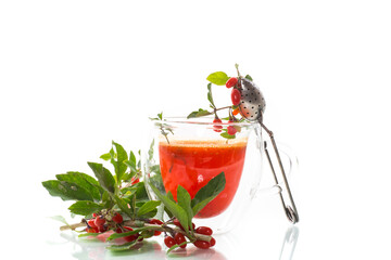 Prepared hot drink from ripe goji berries in a glass cup