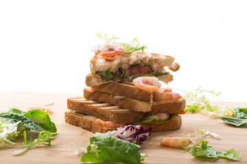 sandwich with lettuce and shrimp.