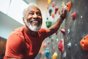 Foto op Canvas African old sportsman exercises climbing on climbing wall © A Denny Syahputra