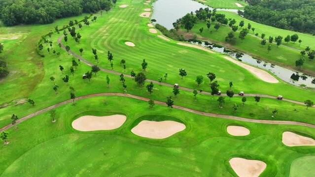 Modern oasis: A drone's perspective captures a sleek golf course with minimalist design, clean lines, and geometric water features.
