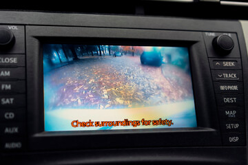 Check surroundings for safety is inscription on inside car display when camera is on when reversing