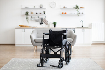 Empty wheelchair in the kitchen. Lonely and healthcare concept.