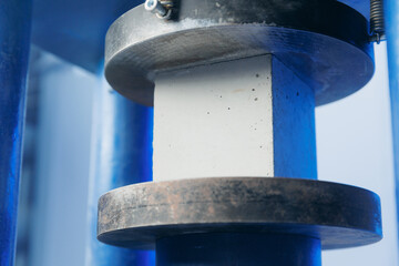Control quality of sample concrete cube in machine press, compressive test of building materials in...