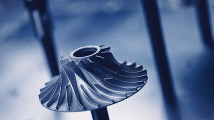 Macro steel blades of turbine propeller blue color, modern industry technology