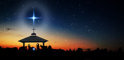 Bright Star of Bethlehem, or Christmas Star. Silhouettes of Jesus Christ, Mary, Joseph and animals. Starry sky at dawn