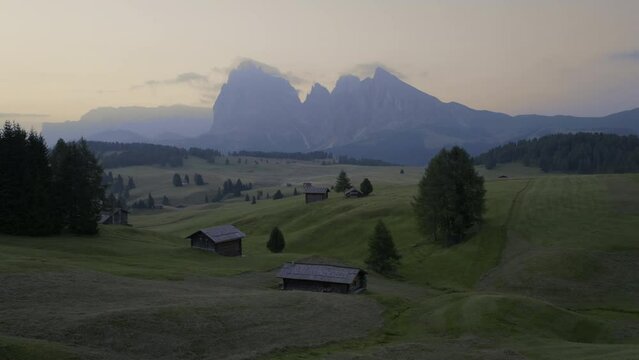 Alpe di Suisi, Dolomites. Aerial drone view of Alpine meadow mountain Plateau in Italy. Sunrise morning landcape scenary at idyllic Seiser Alm valley in South Tyrol. Europe