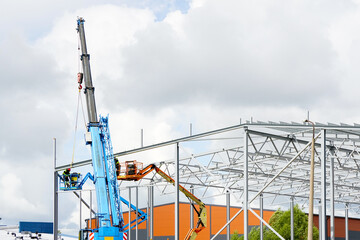 Steel frame structure assembly using telescopic boom crane and self propelled articulating boom lift © Zigmunds