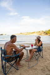 Obraz premium Beautiful served breakfast on a table at seaside in the morning. Fruits, coffee and toast