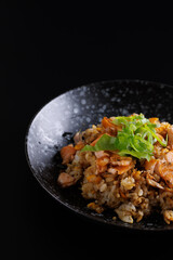 Japanese fried rice yakimeshi isolated in black background