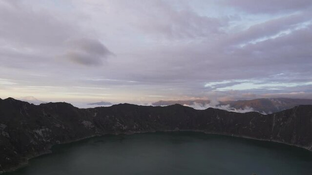 aerial of laguna quilotoa at the quilotoa loop in the andes mountains of Ecuador, is an emerald green lake in a caldera of an old volcano cater and a popular travel destination for hikers.
