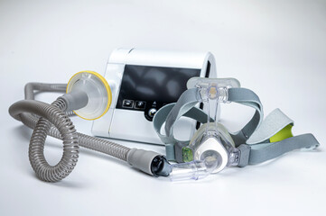 CPAP machine with mask and hose, for people with sleep apnea, respiratory, or breathing disorder - obrazy, fototapety, plakaty