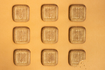 Butter cookies pattern, on yellow background. Top view. Copy space.