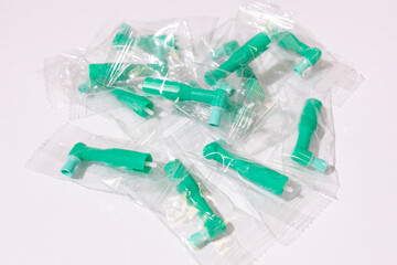 Top View Green Disposable Prophy Angles with Brush, Ergonomic Shape on White Background. Dentistry,...