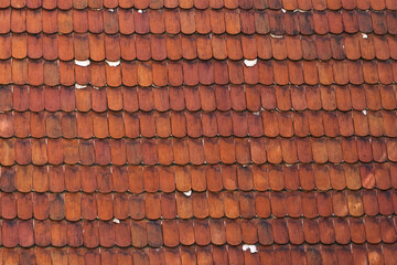 Orange texture of lamellar tiles on the roof.