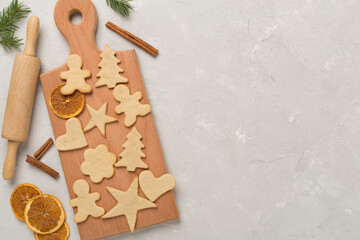 Flat lay with cute homemade Christmas cookies on concrete background,top view
