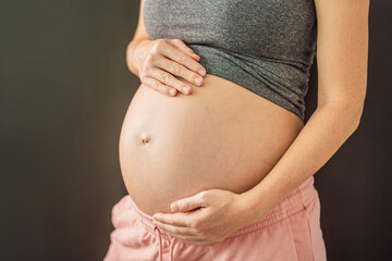 Cropped view of attractive pregnant woman touching large stomach parenthood preparation