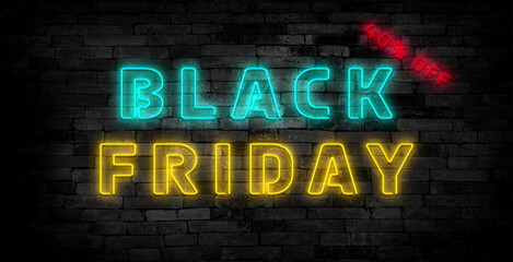 Black friday sign emblem in neon style on brick wall background.