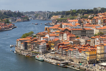 Fototapeta na wymiar Porto, Portugal - May 13, 2018: Traditional architecture of the urban center of the city of Porto with the Douro river, Portugal.