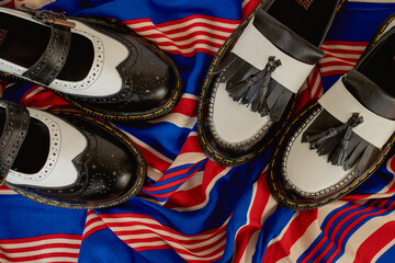 Flat lay photo concept of two pairs of women's shoes in the Mary Jane model and tassel shoes in two...