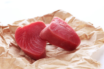 Piece of tuna on white background. natural omega. Isolated object.