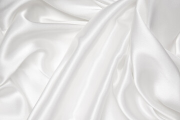 Abstract white fabric texture background. Cloth soft wave. Creases of satin, silk, and cotton.