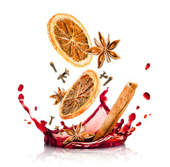 splashes of mulled wine and falling cinnamon, dried orange, anise and cloves, isolated on a white...