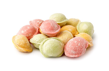 Colorful raw dumplings on white background