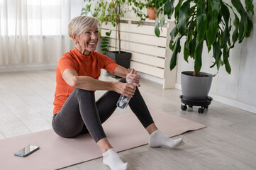 Portrait of smiling beautiful senior woman health instructor. Best Exercises for Older Women. Yoga classes for seniors.