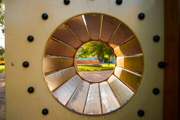 Wooden tunnel on the playground. Selective focus