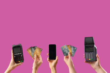 Women with payment terminals, credit cards and mobile phone on purple background - obrazy, fototapety, plakaty
