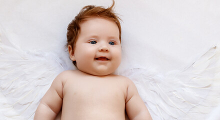 Beautiful Baby . Cute infant angel with wings isolated on white. lovely baby with wings of an angel...