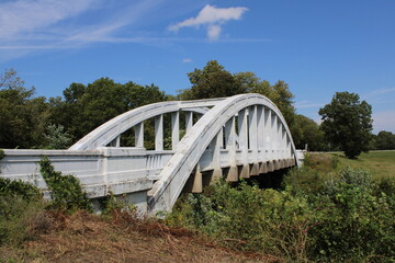 Riverton, Kansas, USA; October 23 2023: Rainbow curve bridge. Constructed in 1923 over Brush Creek...