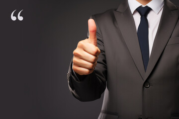 businessman showing thumbs up in a copy space background, Testimonial review banner, positive business quote, mental health day concept, Businessman in a suit gives the client satisfaction thumbs up