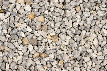  Shallow focus on small gravel, creating a unique road texture pattern.