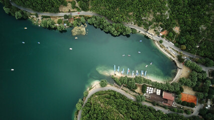 Beautiful views of the summer lake from a bird's eye view of the picturesque sandy bay. Lake Scanno, Abruzzo, Italy
