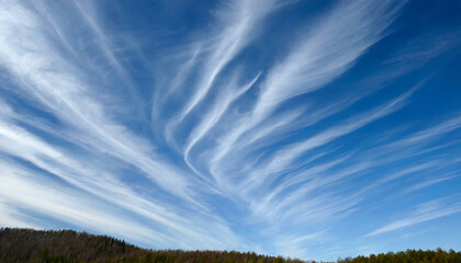 high white wispy cirrus clouds with cirri stratus in the blue sky
