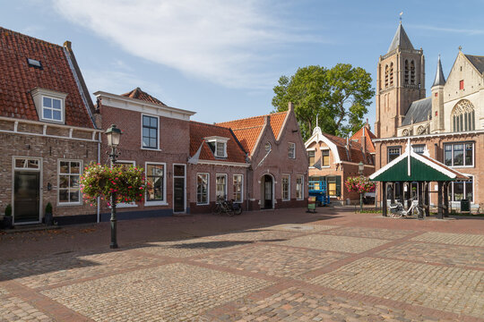 Market square with the medieval Church of Our Lady in the background in the center of the city of Tholen in the province of Zeeland.