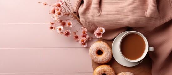 Autumn themed flat lay with sweater coffee donut and bag - obrazy, fototapety, plakaty