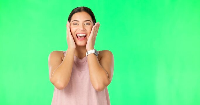 Shock, surprise and face of woman on green screen for good news, announcement and discount in studio. Excited, happy and portrait of isolated girl smile with shocked, wow and omg facial expression