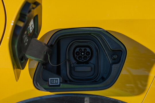 Charging port on yellow electric vehicle