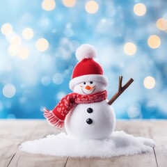 Fototapeta premium Cute snowman wearing red scarf on a snowy area and bokeh light background