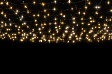 Gold Twinkle Christmas string lights on black background.