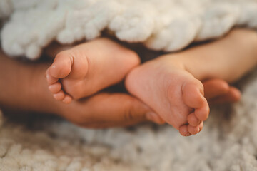 New Born Baby Feet on White Blanket